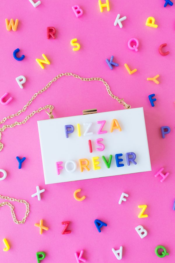 Box purse that says \"pizza is forever\"