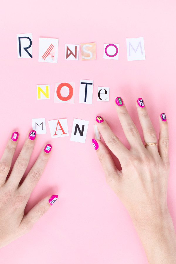 Someone with pink nails and lettering
