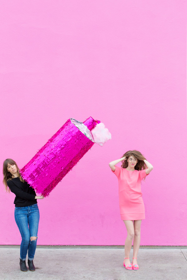 Two women and a spray bottle pinata