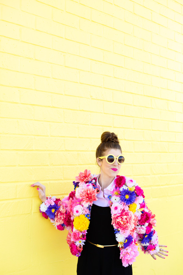 A woman wearing a floral jacket