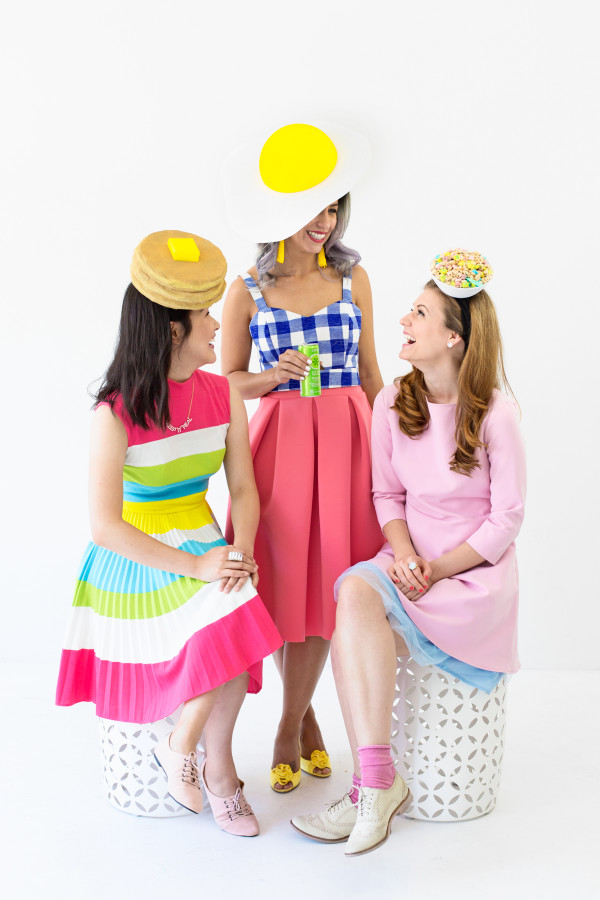 Three people wearing Kentucky Derby outfits 