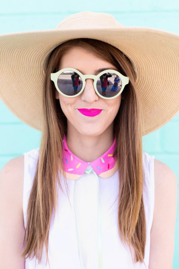 A woman wearing sunglasses and a hat