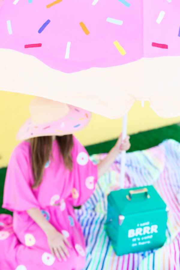 Someone in a pink dress holding an umbrella