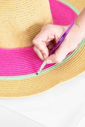 Someone painting a hat