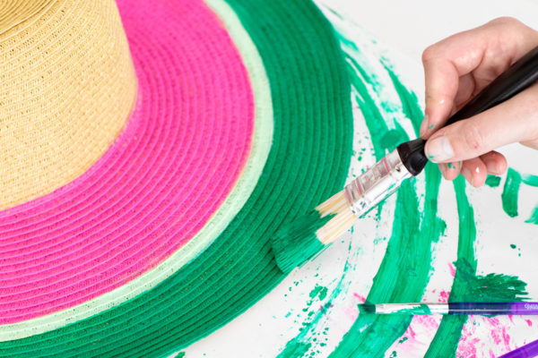 Someone painting a hat