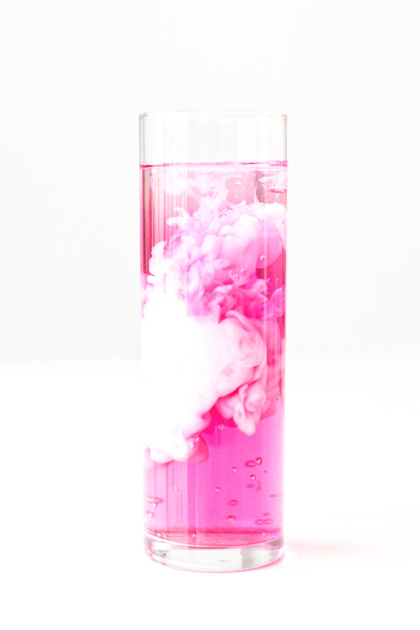 Pink and white liquid in a glass