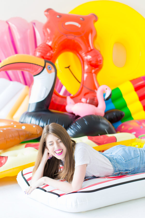 A woman sitting on a floatie