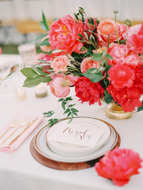 A plate with utensils and flowers 