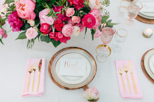 A plate with utensils and flowers 