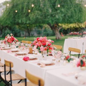 A table with flowers and chairs