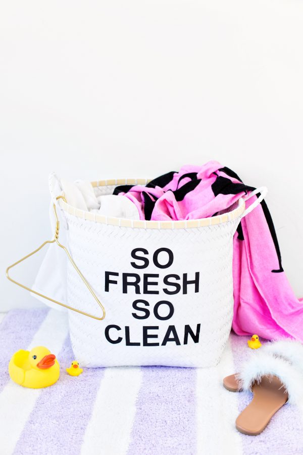 Laundry basket that says \"so fresh so clean\" 