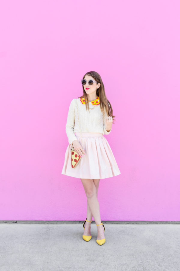 A woman wearing a pizza costume