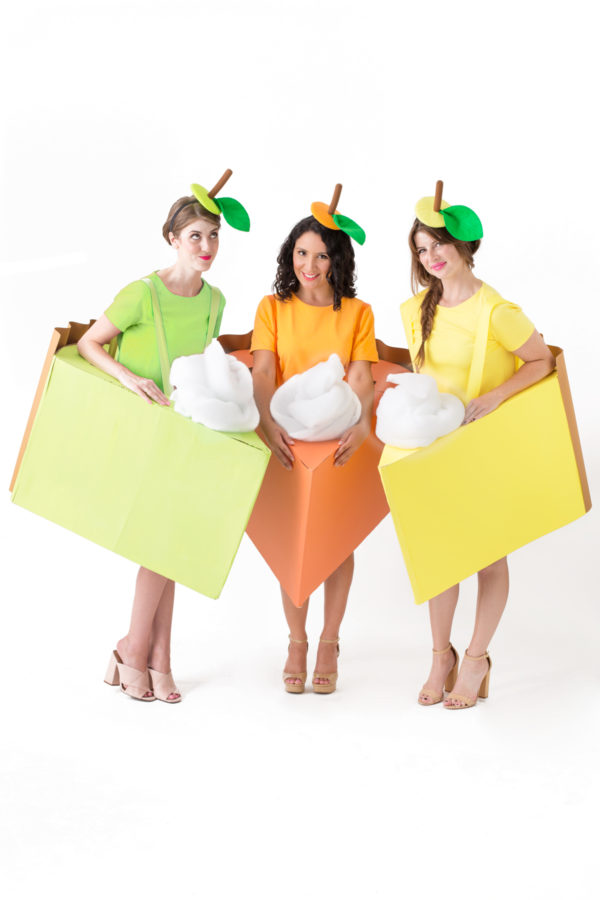 Three people dressed as pie slices