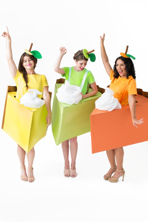 Three people dressed up as pie slices