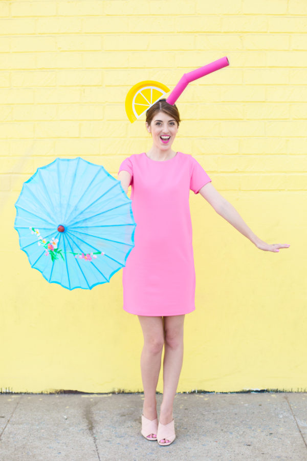 A woman holding a blue umbrella