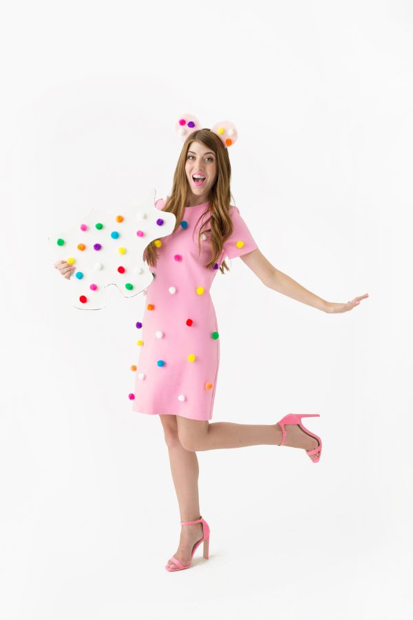 A woman dressed up as a frosted animal cookie