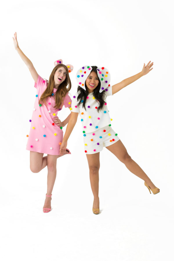 Two girls dressed as frosted animal cookies