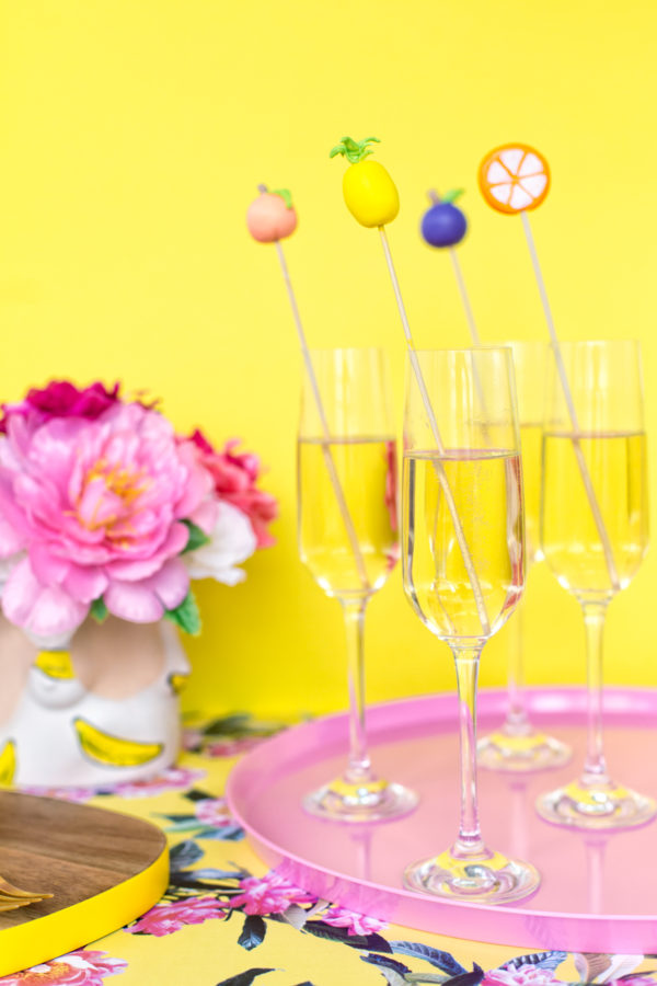 Wine glasses with fruit stirrers