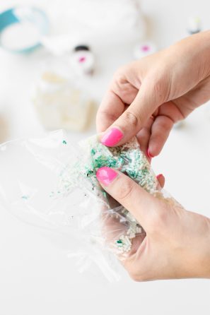 Someone holding a bag with sprinkles 