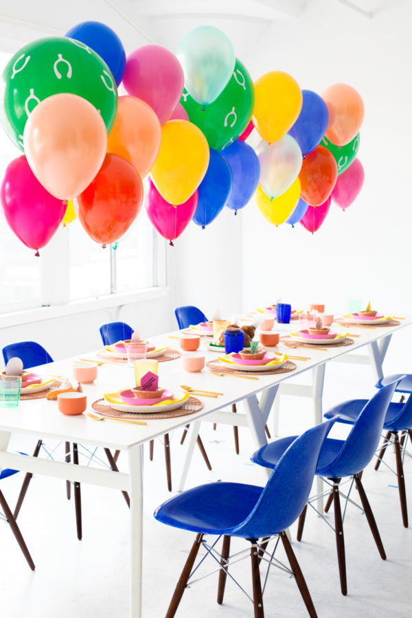 A dining room table with balloons