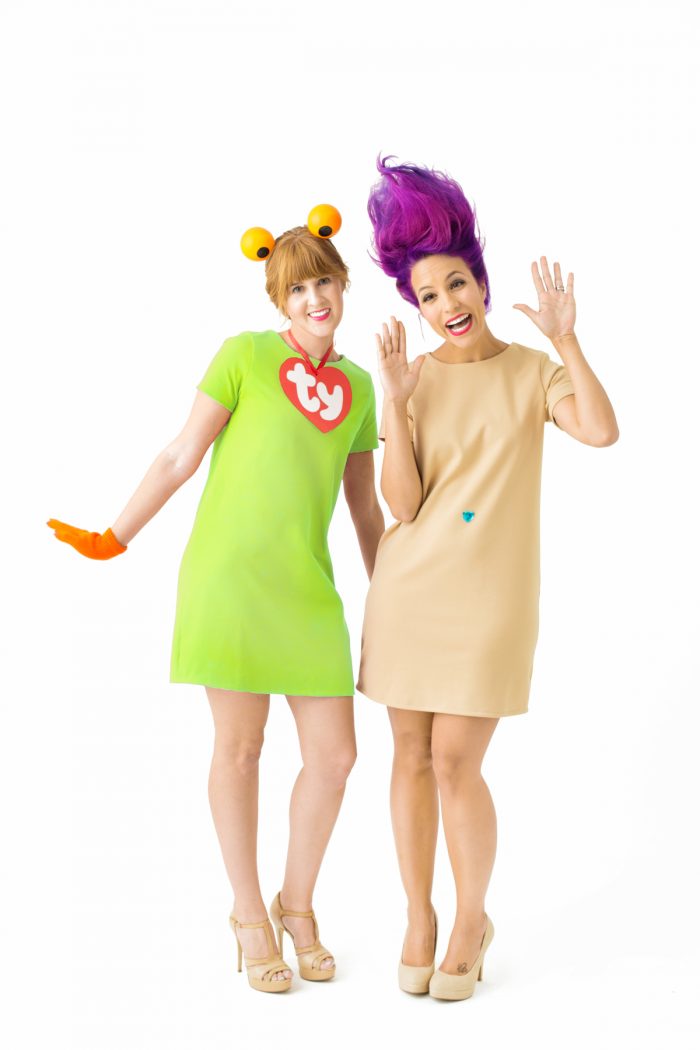 Two girls dressed in toy costumes