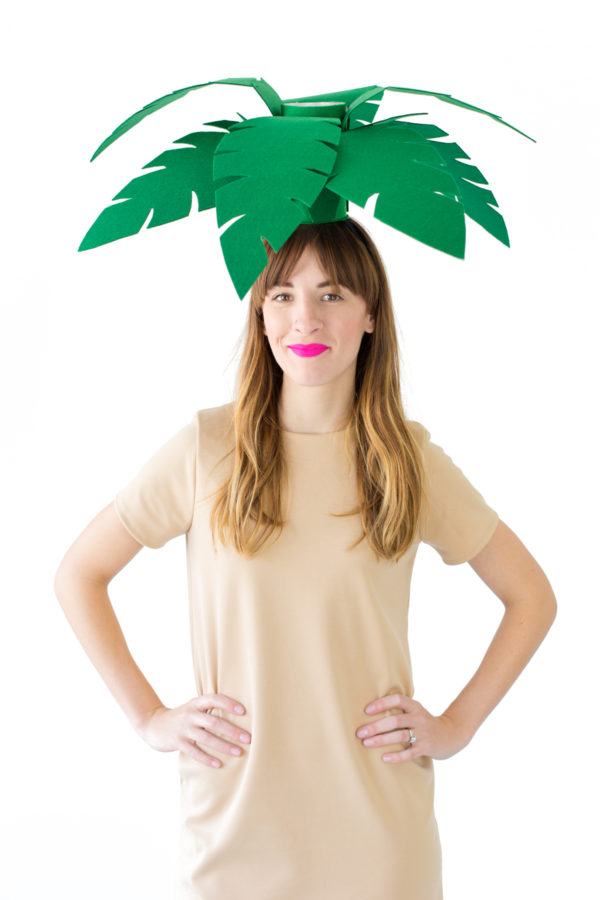 A woman dressed as a palm tree