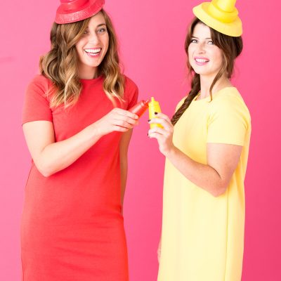 Two girls dressed as ketchup and mustard 