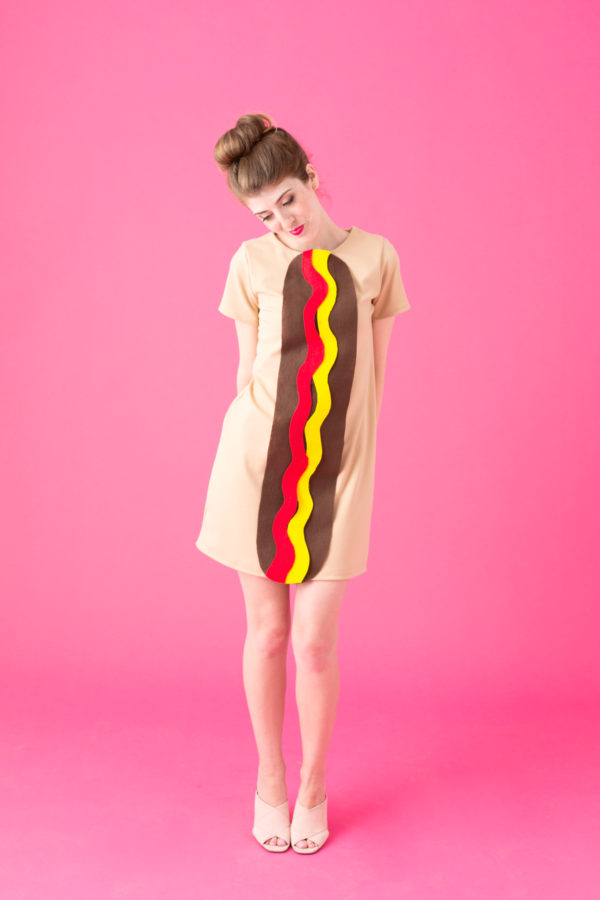 A woman dressed up as a hot dog