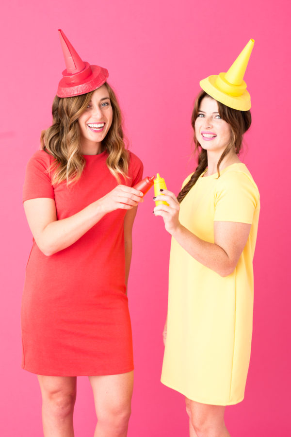 Two girls dressed as ketchup and mustard 