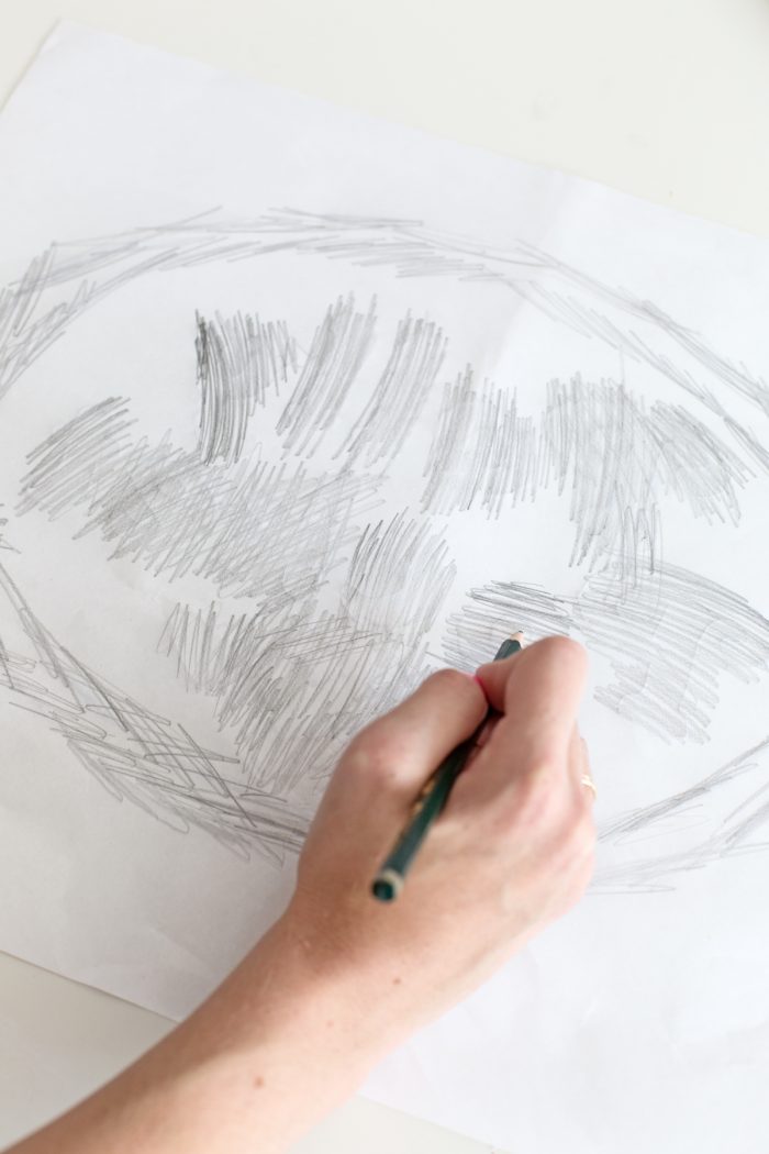 Someone drawing something on a paper