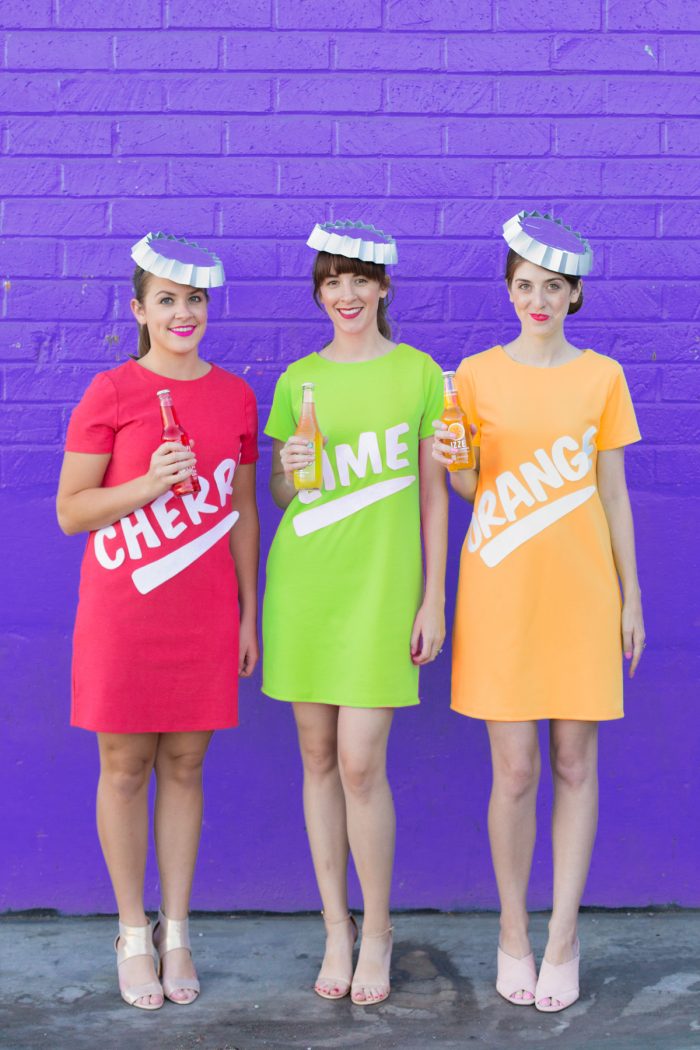 A group of people dressed up as soda bottles 