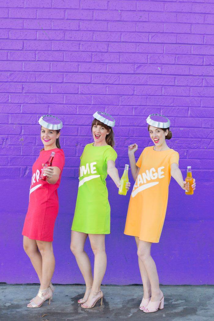 A group of people in soda costumes