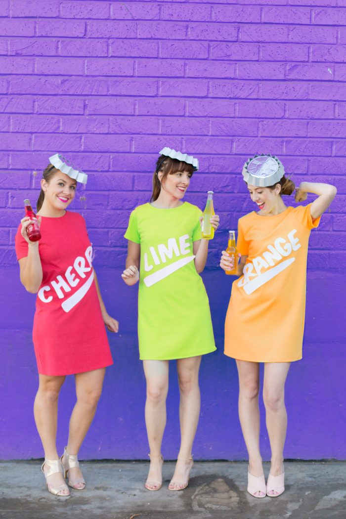 Three people dressed as soda