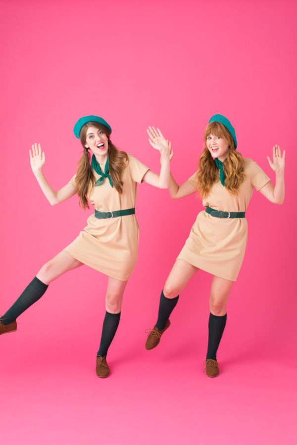Two woman dressed as girl scouts 