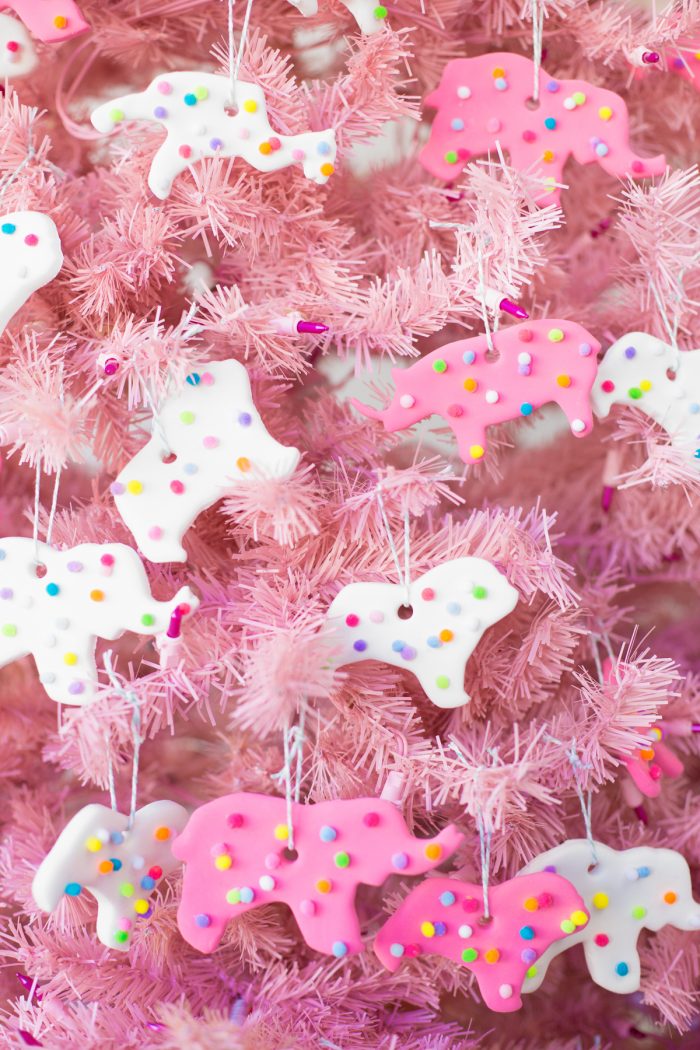 DIY Circus Animal Cookie Ornaments hanging on a pink tree. 