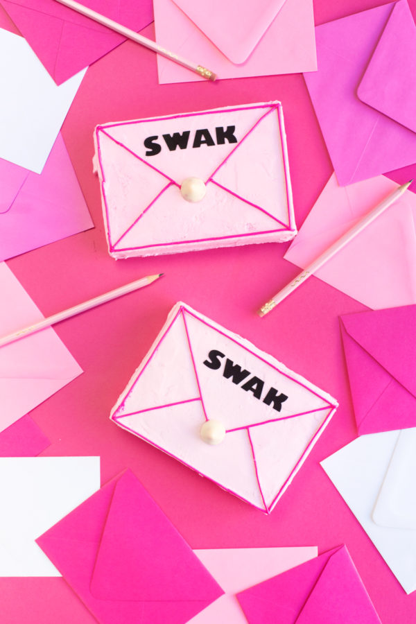 Pink cake that says swak on it