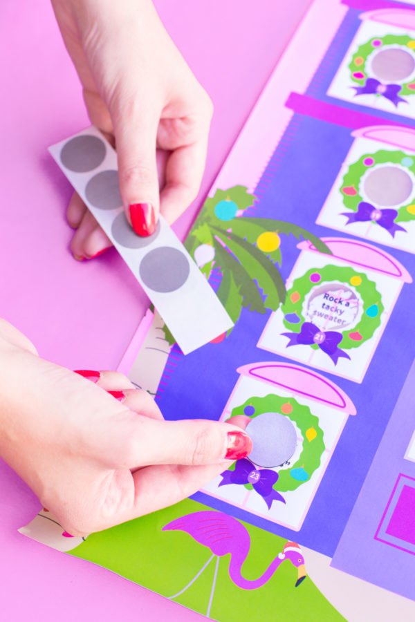 A purple and pink paper and grey circular stickers 