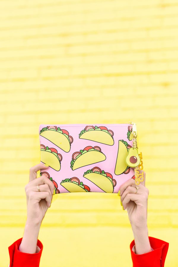 Taco clutch in front of a yellow wall