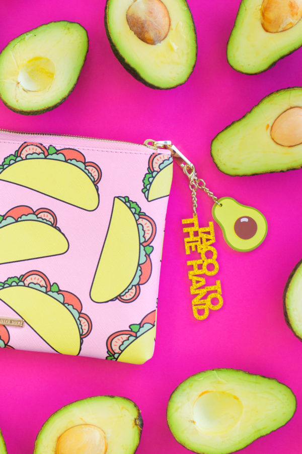 Taco clutch next to avocados 