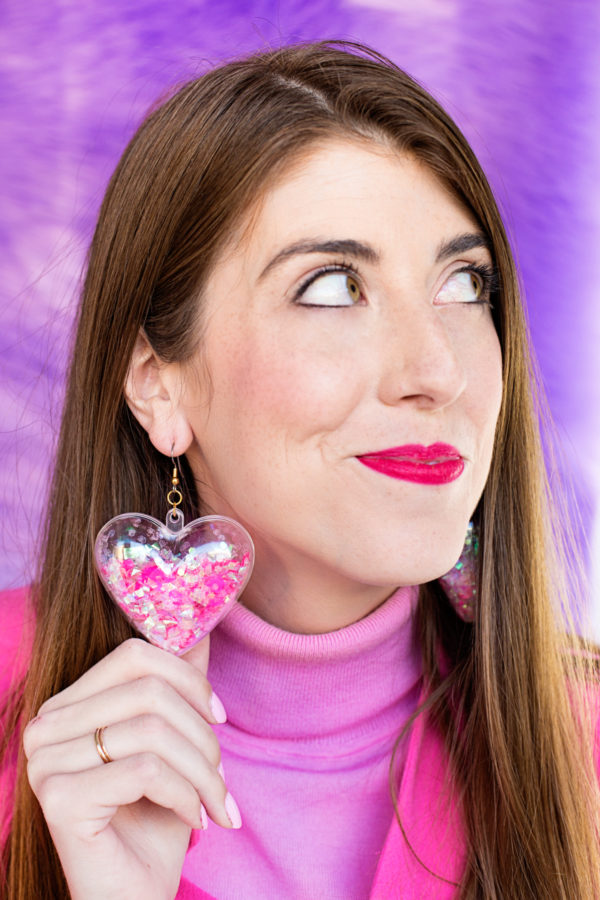 A woman wearing confetti earrings