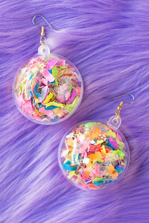 Confetti earrings on a purple fur fabric