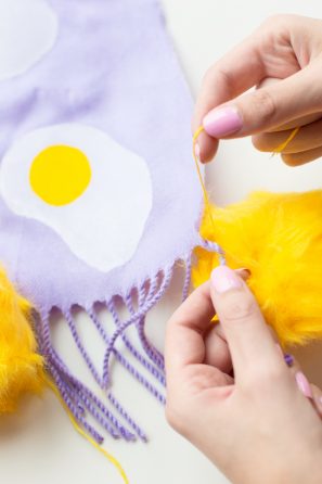 Purple fabric with egg on it