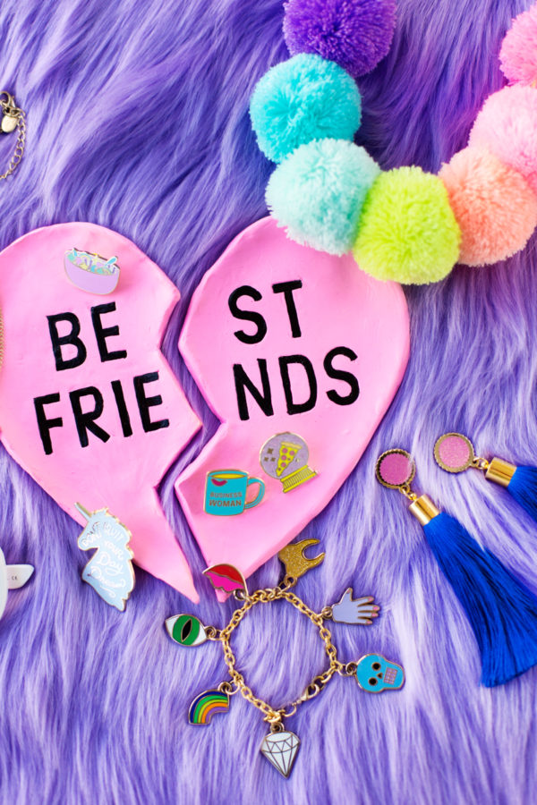 A pink ring dish that says best friends