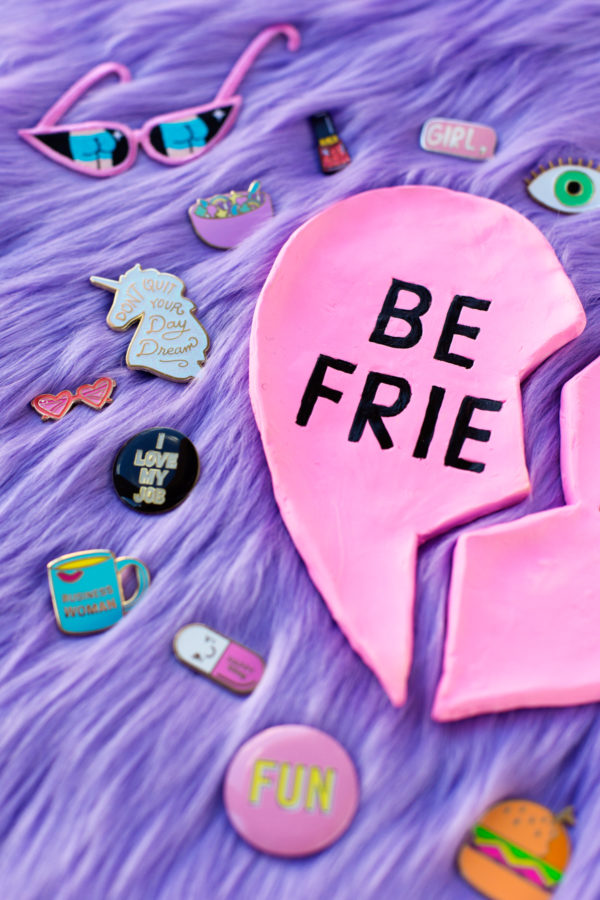 A ring dish that says best friends and pins