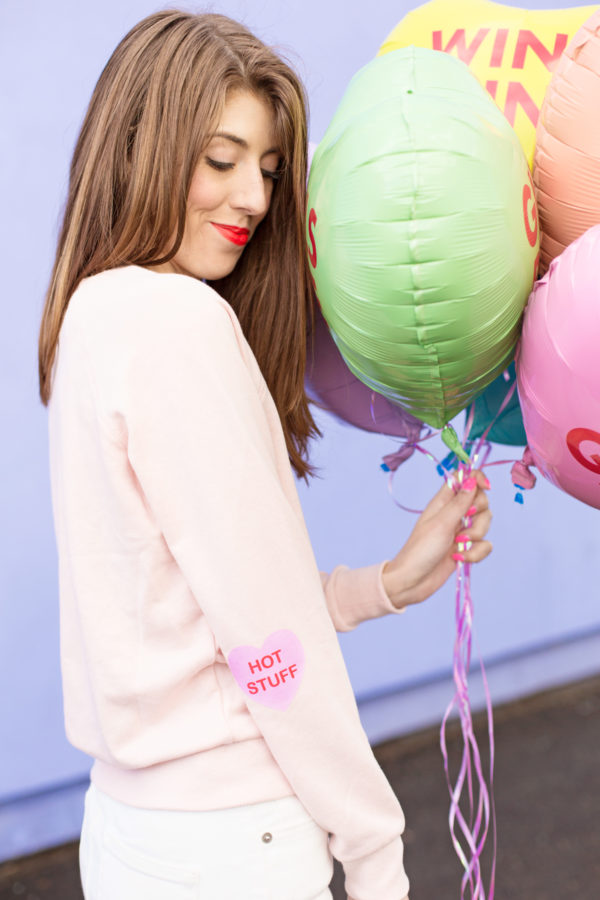 A woman holding balloons