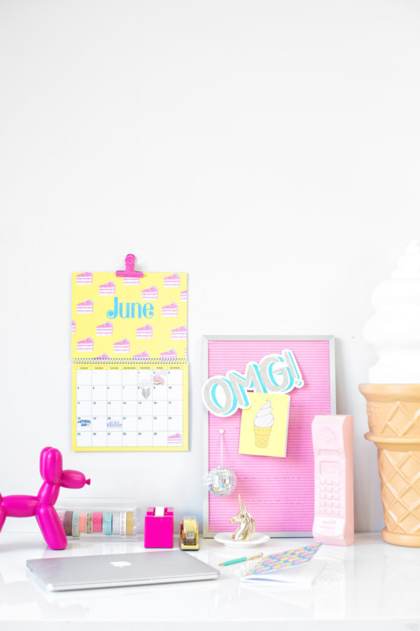 A desk with a board and a calendar 