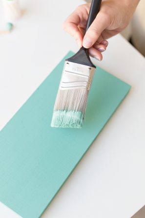 Paint brush and turquoise board 