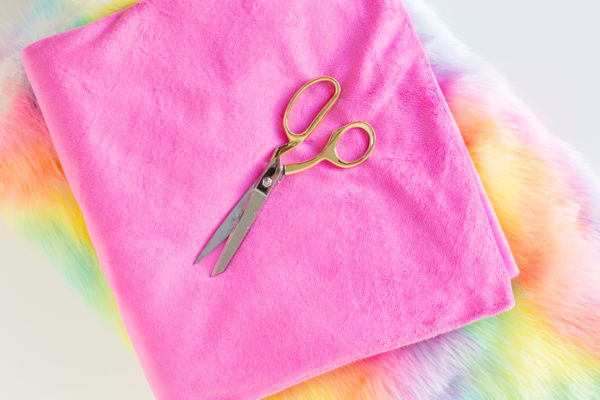 Pink fabric and scissors