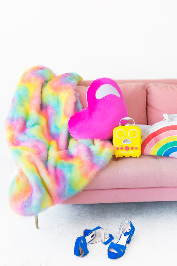 Rainbow blanket on a pink couch