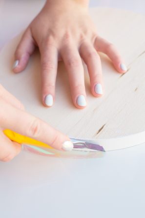 Someone touching a wooden circle